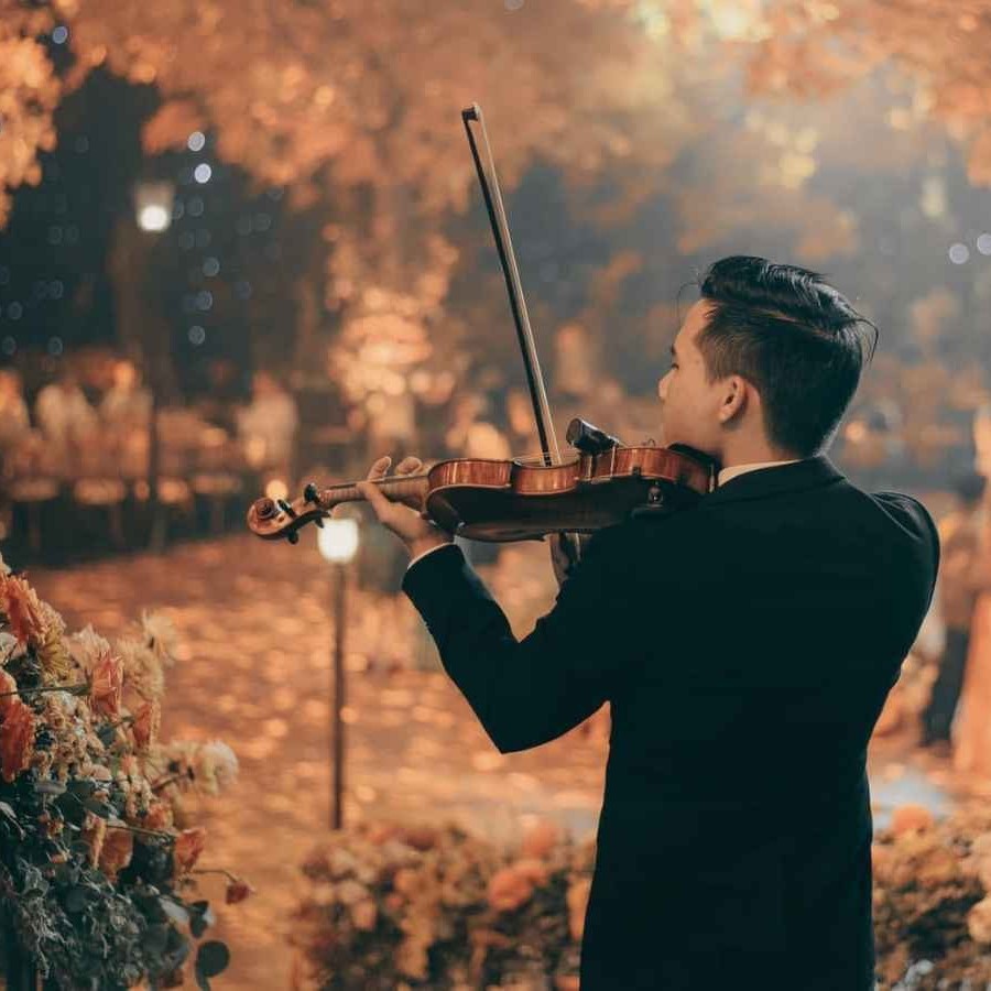 Celebratory live music accompanying the couple after the ceremony