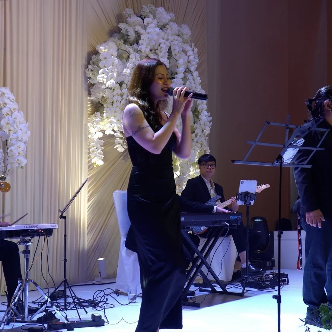 Violin and string musicians performing during a wedding ceremony in Vietnam