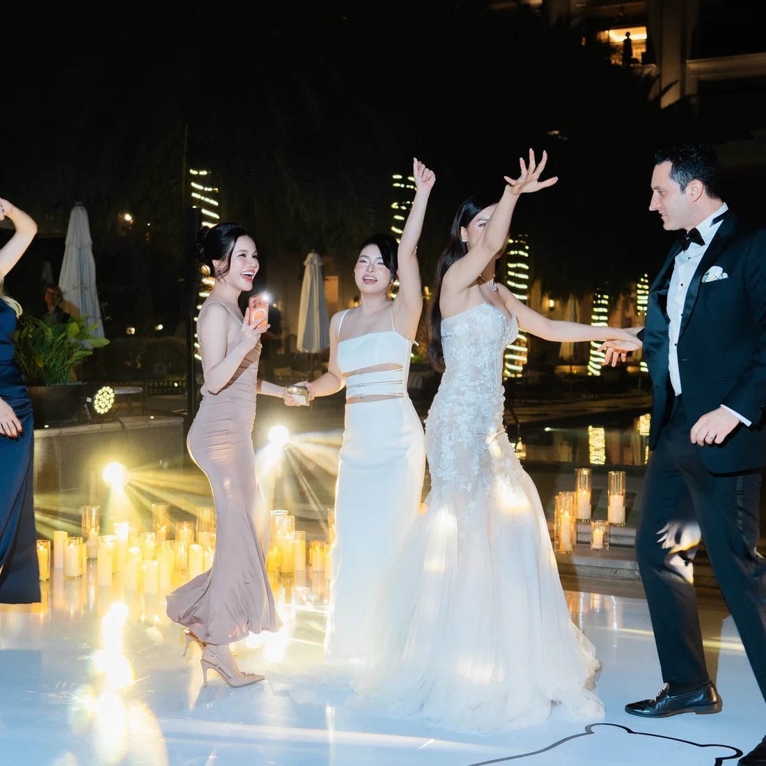 Guests dancing as Lux Band performs during a wedding after-party