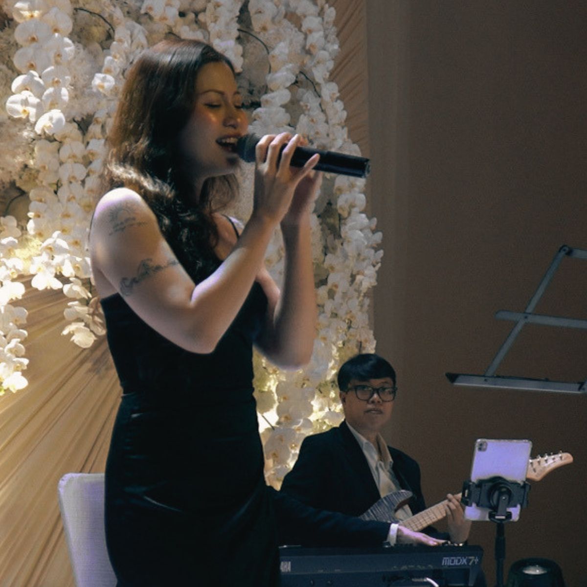 Live musicians performing beneath the high ceiling of a GEM Center ballroom