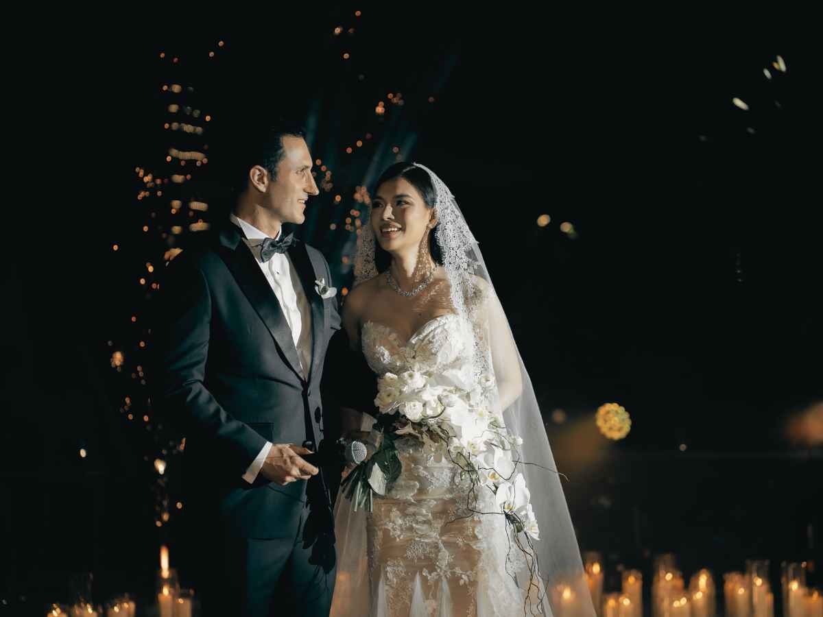 Live ceremony musician performing as a couple enters an elegant wedding space